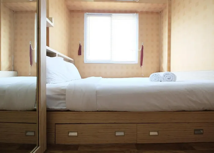 Relaxing 2BR with Pool View Mutiara Bekasi Apartment By Travelio